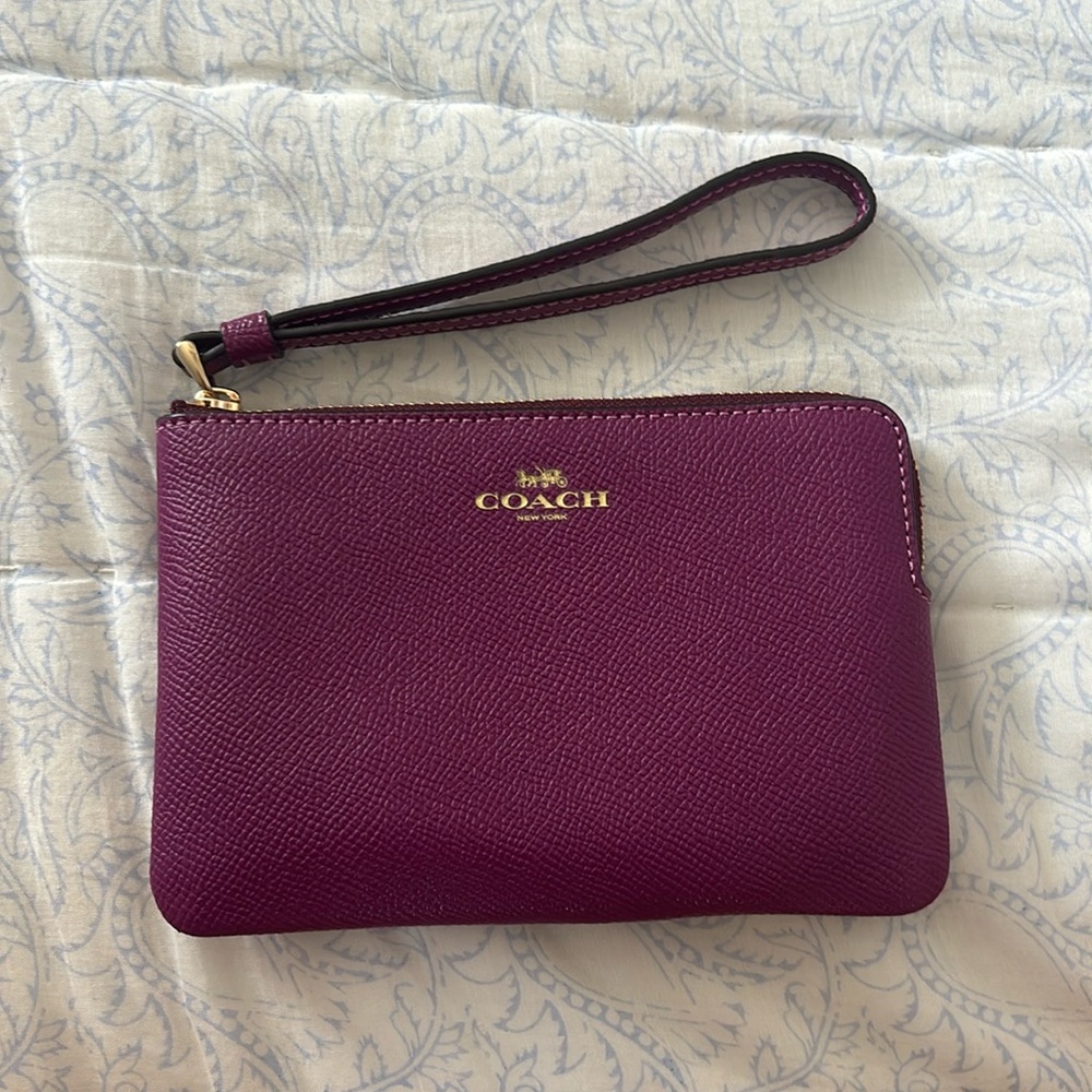 Coach Wristlet in Magenta Color with gold accents